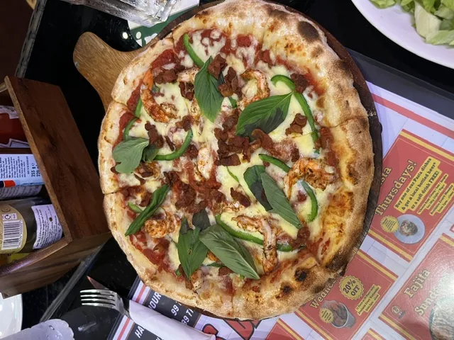 A wood-fired pizza, the Western end of the price range