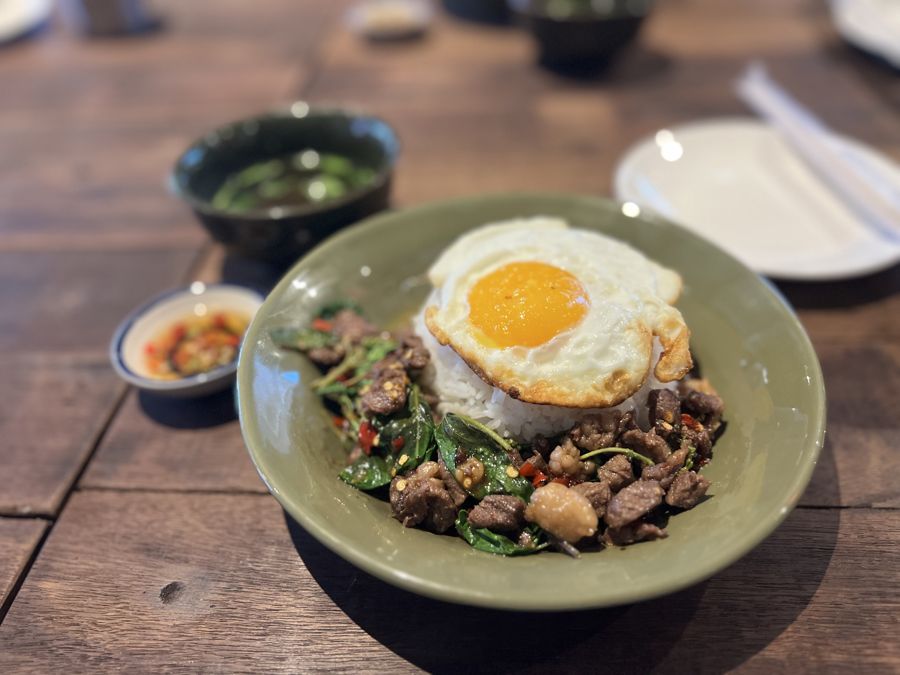 A Thai minced pork dish with a fried egg, served over rice