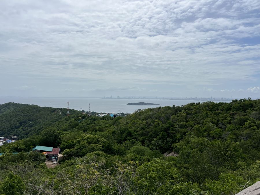 A hilltop view over the green hills and the bay near Pattaya